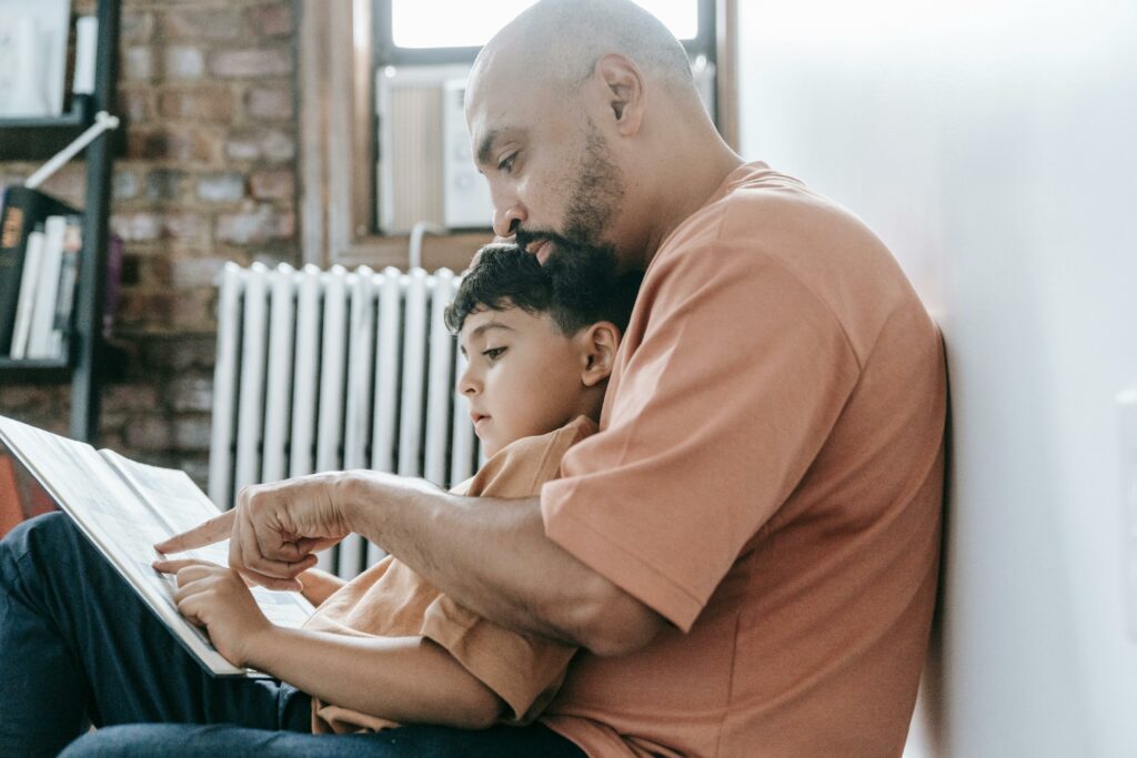 father reading with child